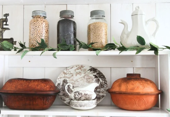 Farmhouse kitchen open shelving with antique decor pieces